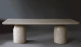 Nexus Dining Table in Oyster finish, front view showcasing its smooth micro cement surface